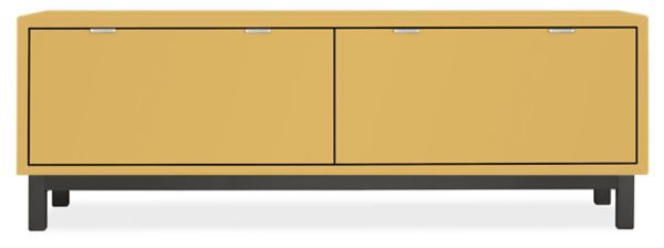 a yellow cabinet with two doors and drawers