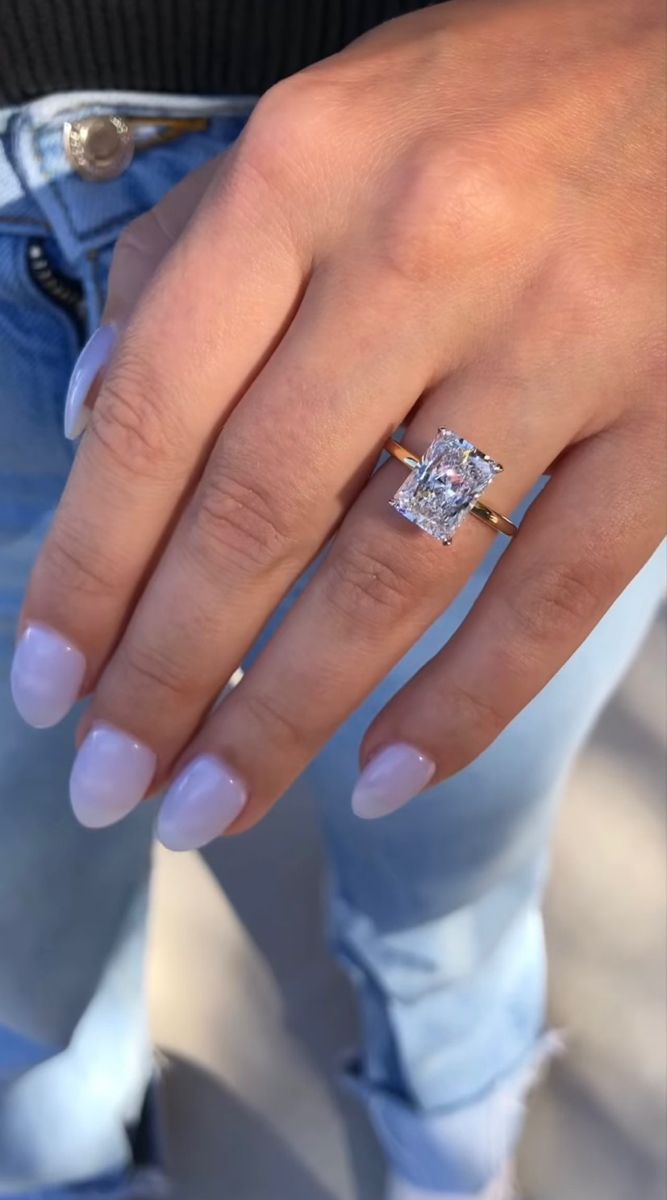 a woman's hand with a ring on it