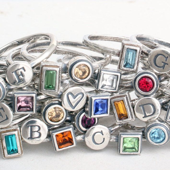 "How fun is it to make your own ring using the initials and birthstones of those you love?! Unleash the inner jewelry designer and pick from all of our hand crafted silver bands and birthstone rings to build a family ring or mother's ring you will cherish forever. Also available in gold bands at this listing: https://www.etsy.com/listing/825827495 ♥♥ HOW TO ORDER ♥♥- 1. CHOOSE YOUR SIZE 2. CHOOSE YOUR COMBINATION 3. IN THE COMMENTS SECTION AT CHECKOUT PLEASE INCLUDE: a. WHAT INITIALS AND/OR SYMB Personalized Silver Crystal Ring, Silver Stackable Rings For May Birthstone, Adjustable Sterling Silver Stackable Rings For May Birthstone, Adjustable Sterling Silver Stackable Rings, May Birthstone, Personalized Adjustable Crystal Ring For Anniversary, Adjustable Silver Birthstone Ring For May, Adjustable Silver Ring For May Birthstone, Birthday Adjustable Stackable Sterling Silver Rings, Birthday Stackable Sterling Silver Jewelry