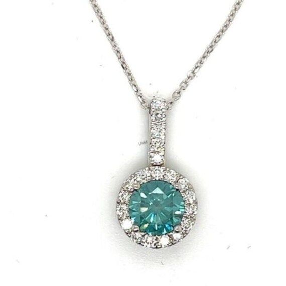 Stunning Diamond Halo Pendant and Chain Set in 18k White Gold The pictures don't fully capture the sparkle coming off of these diamonds. This could be the something blue for your wedding day Or a wonderful anniversary, birthday  or treat myself gift! The piece features a  beautiful Blue/ Green Diamond that is about a half a carat which is surrounded by 15 Bright White Diamonds for a total carat weight of 0.69 carats. The diamonds are prong set and the pendant is suspended on a 16 inch 18k solid White Gold Chains, Halo Pendant, Green Diamond, Diamond Halo, Blue Diamond, Something Blue, White Diamonds, Halo Diamond, Beautiful Blue