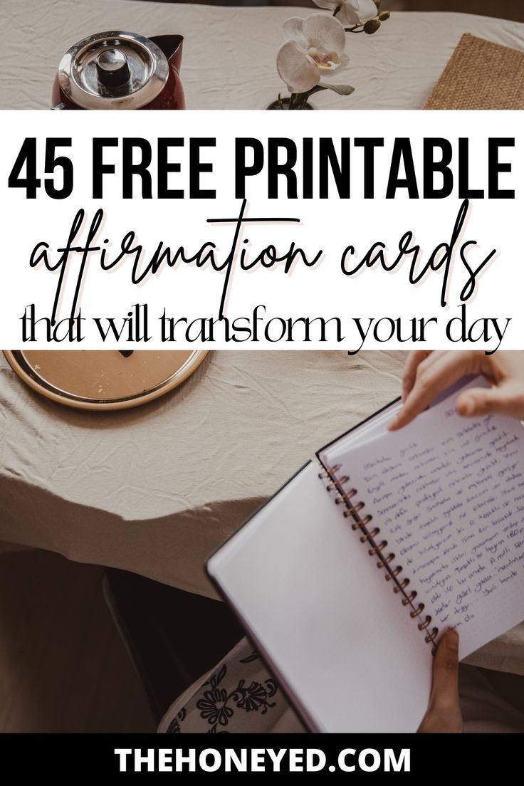 a person writing on a notebook with the text, free printable affirmation cards it