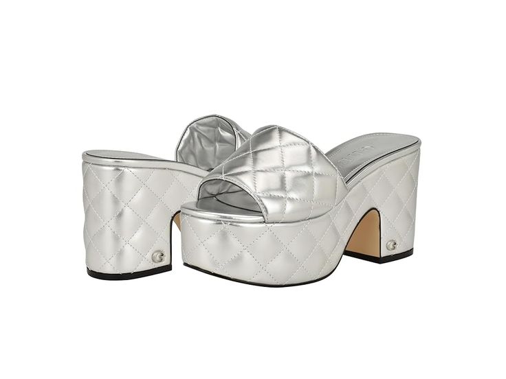 GUESS Yanni - Women's Sandals : Silver : Get the perfect fit for your foot wearing the classy GUESS Yanni. Crafted from faux leather upper, this pair of sandals features open almond toe, slip-on closure, wedge heel, and quilted texture design allover. Man-made lining and rubber insole. Polyurethane outsole. Imported. Measurements: Heel Height: 3 7 13 in Platform Height: 2 1 6 in Product measurements were taken using size 7, width M. Please note that measurements may vary by size. Silver Leather Sandals With 4-inch Heel, Glamorous Metallic Silver Heels With 4-inch Heel, Texture Design, Wedge Heels, Womens Sandals, Heel Height, Leather Upper, Shoes Heels, Wedges