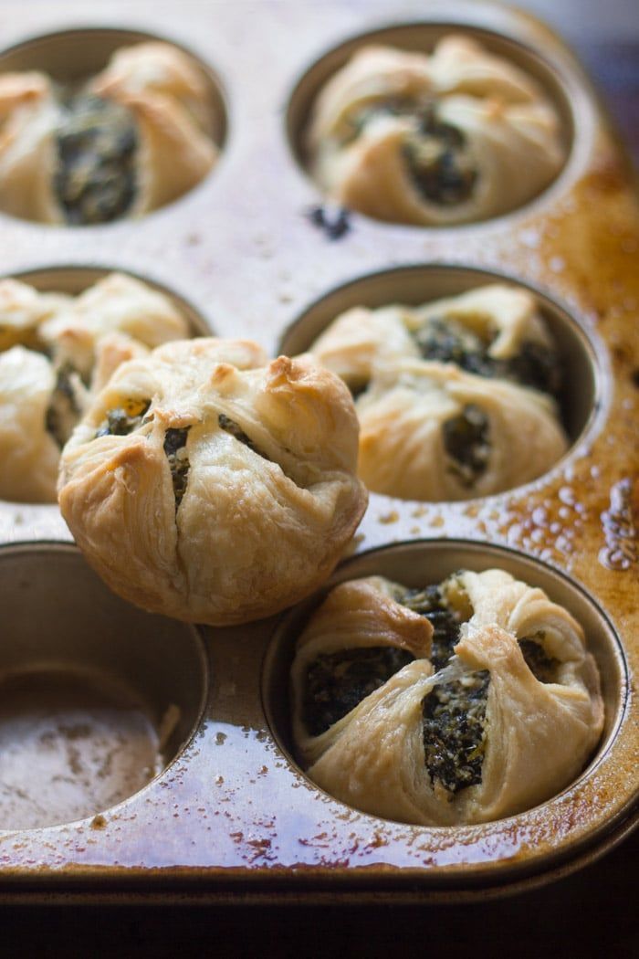 a muffin tin filled with mini pastries