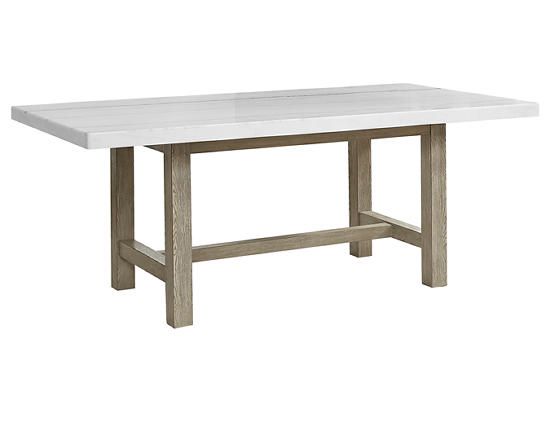 a white table sitting on top of a wooden floor