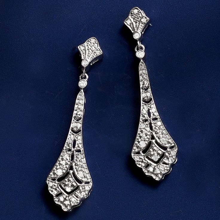 Ross-Simons - .15 ct. t. w. Diamond Openwork Drop Earrings in Sterling Silver. Jazz up your look with our embellished pair. The sterling silver vintage-style designs glitter with .15 ct. t. w. diamonds, boasting intricate openwork. Hanging length is 1 1/2". Post/clutch, diamond openwork drop earrings. Diamond birthstones are the perfect gift for April birthdays. Ornate Diamond Accent Drop Earrings, Classic Bridal Earrings For Evening, Silver Diamond Earrings For Evening, Classic Chandelier Earrings With Diamond Accents For Evening, Ornate Silver Diamond Earrings For Formal Occasions, Ornate Silver Diamond Earrings, Formal Silver Rhinestone Earrings, Classic Sparkling Crystal Drop Earrings, Sparkling Silver Clip-on Earrings For Evening