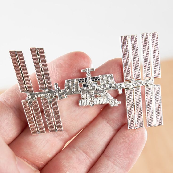 The most accurate International Space Station Enamel Pin on Etsy! As true to the original ISS as we could make it. This hard enamel pin makes the perfect gift for your resident astronaut, scientist, astronomer, rocket engineer, or space lover.  100 pins made.   1st Edition.  Year: 2021 Silver plated brass pin. 3 inches Comes individually packaged with two silver butterfly clasps. Space Scientist, Nasa Gifts, Nasa Astronaut, Lapel Brooch, Space Lovers, Brass Pin, Nasa Space, International Space Station, Silver Butterfly