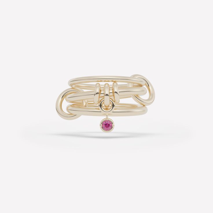 The Piera linked ring is comprised of three linked bands and features a trio of annulets with a central drop charm. Each ring in either 18k gold or .925 sterling silver is paired with a bezel-set stone in striking contrast and tactile appeal. Each Piera linked ring is individually handmade in Los Angeles. Ring With Charms, Modern Twist Yellow Gold Jewelry With Ring Detail, Timeless Double Band Ring With Detail, Timeless Double Band Ring Jewelry, Spinelli Ring, 4 Stone Ring, Infinity Band Ring, Galaxy Ring, Infinity Band