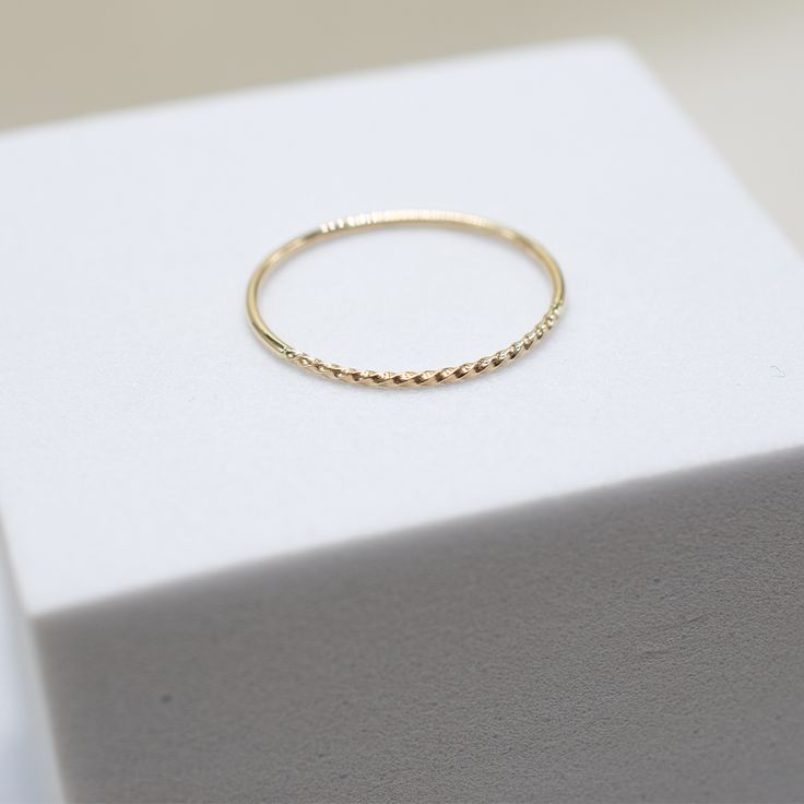 our Tiny Dancer Ring is as much of a classic as the beloved song it is named after. an ideal choice for minimalists or active lifestyles, you can't go wrong with this effortless band. ideal for stacking and a staple in curating your capsule jewelry collection. fine 14k solid gold .49 grams .9mm thick Stackable Yellow Gold Bands For Everyday Wear, Everyday Stackable Yellow Gold Bands, Minimalist Double Band Stackable Rings, Minimalist Stackable Double Band Midi Rings, Minimalist Stackable Everyday Rings, Everyday 14k White Gold Midi Rings, Everyday White Gold Midi Rings, Minimalist Adjustable Double Band Stackable Rings, Everyday Stackable White Gold Midi Rings