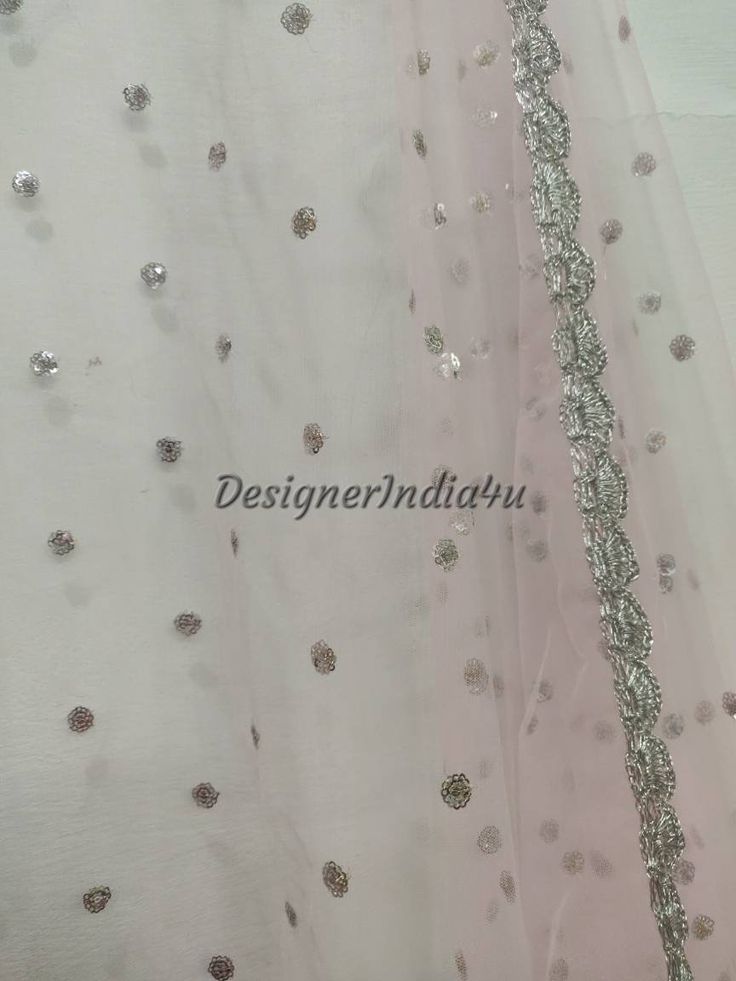 This is a Dupatta made on orders. It is made using dyeable net fabric with silver sequine embroidery all over. We make it colored as shown in the picture. Then we stitch a beautiful silver lace to all sides of it. Dupatta is having a length of 100 inches and width of around 40 inches. I don't keep it readymade I only make it exclusively for my customers. Can be fully customised. Party Wear Dupatta With Mirror Work For Diwali, Pink Gota Work Choli For Eid, Pink Unstitched Choli With Gota Work, Navratri Party Wear Dupatta With Sequins, Festive Pink Choli With Sheer Dupatta, Pink Sharara With Mirror Work For Festivals, Festive Pink Choli With Mirror Work, Pink Anarkali Dupatta With Dori Work, Party Wear Pink Salwar Kameez With Traditional Drape