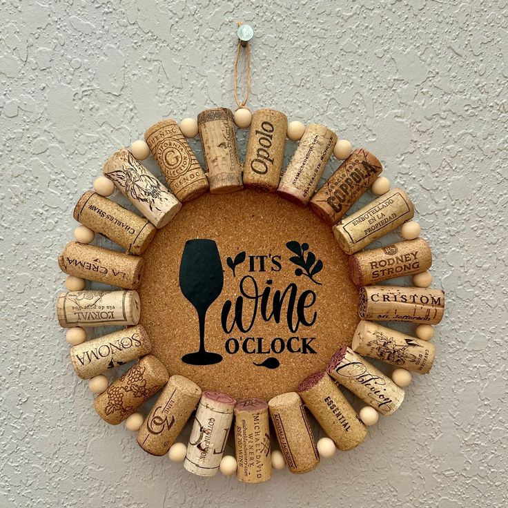 a wine cork wreath with the words it's wine oclock on it