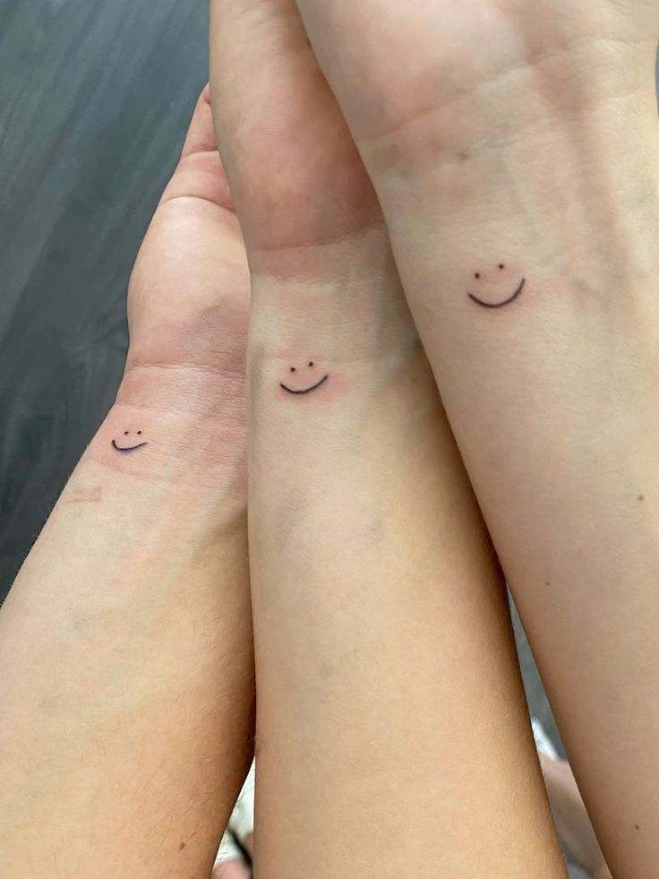 Sibling tattoo :) smiley Tattoos Ideas For 3 Friends, Small Tattoos For 3 Siblings, Matching Tattoos For Trio Best Friends, Simple Tattoos For Siblings, 3 Siblings Matching Tattoos, 3 Sibling Matching Tattoos, Brother And Sister Tattoo Ideas Small Funny, Small Sibling Tattoos For 4, Tattoo Ideas 3 Siblings