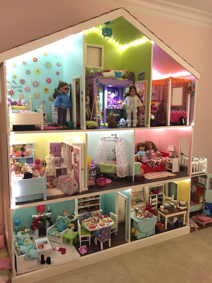 a doll house with lots of furniture and accessories