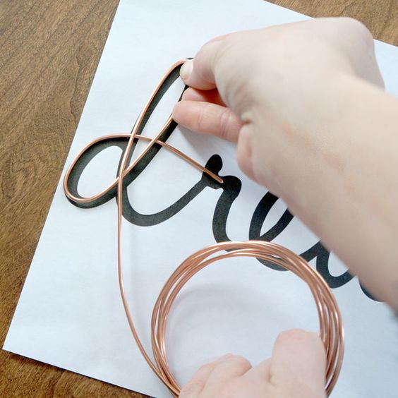 a person is doing something with copper wire