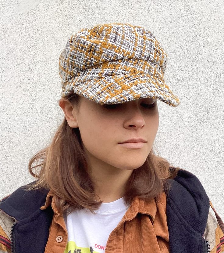 This tweed recycled wool cap in colours of yellow ochre, grey and cream will add style to any outfit. It is fully lined in brown cotton and has an inner cotton moleskin band for comfort. Size M to fit head size 57cm/22.5 inches * Dry clean only To see more of my hats please click https://www.etsy.com/uk/shop/OverToYou I design, pattern cut and create all my hats in sunny Brighton in the South of England. All my designs are original and combine timeless elegance with a modern twist. I despatch my Cotton Flat Cap For Fall, Casual Tweed Hats For Fall, Brown Cotton Hat For Fall, Brown Tweed Hat For Fall, Beige Cotton Hat For Fall, Cotton Cap For Fall, Brown Cloche Cap For Fall, Trendy Yellow Hats For Fall, Brown Fall Cloche Hat