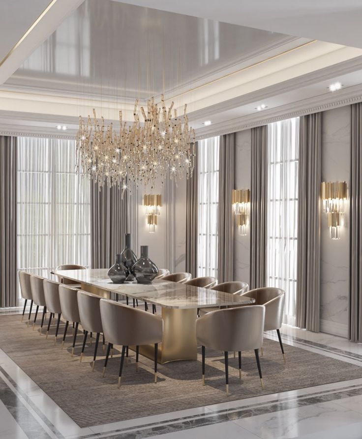 an elegant dining room with chandelier and marble table surrounded by beige upholstered chairs