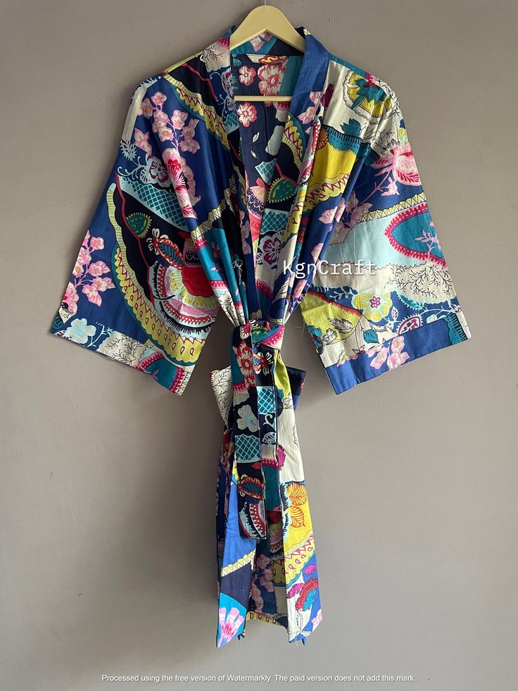 This kimono is made very neatly, and the matching strap has also been used in almost many places in the kimono, which makes the kimono very much. giving a beautiful look It looks good in the photo, but it looks great after wearing this kimono 100% Soft Cotton Hand Block Print Fabric Robe. The perfect to cover up your dance costume, to use for a dinner party or just slip into in on a beautiful summer morning. This particular beauty has a Japanese feeling to it. Cotton kimono robes are perfect for lounging around the home or spa. Use our Floral Hand block print robe :) Measurements: Size: Short & Free Size/ Plus Size Bust Approx: 120 CM ( 47 inch ) Length:100 CM ( 39 inch ) :) Fabric: 100% Pure Soft Cotton Fabric :) 2 Side Pockets :) Color: Multi-color as Shown in Image. Note: Due to Differe Blue Summer Kimono For Home, Summer Blue Kimono For Home, Blue Summer Sleepwear With Kimono Sleeves, Blue Sleepwear With Kimono Sleeves For Summer, Blue Cotton Sleep Kimono, Multicolor Summer Sleep Kimono, Blue Kimono Sleeve Robe For Home, Blue Robe With Kimono Sleeves For Home, Blue Floral Print Robe For Home