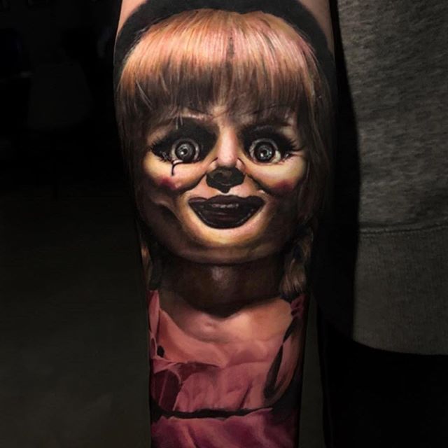 a person with a creepy face on their arm