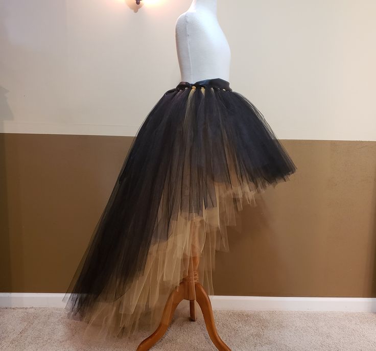 I CAN MAKE THIS TUTU IN ANY COLOR AND SIZE, PLEASE NOTE THE EXACT TULLE AND RIBBON COLOR AT CHECK OUT (Without note I will make it same color with 1st list photo in Black over Gold). 1ST PHOTO TUTU LENGTH FRONT 20'' KNEE LENGTH, BACK 44'' FLOOR LENGTH, FOR HEIGHT AROUND 5'3'' wear a couple inches of heels . This tutu is made with 250-500 yards of 6'' wide fine tulle so it's super full. Stretchy waist along with a big ribbon bow ties on the waist. (I might use 2''or 1.5'' ribbon depends on which Big Ribbon Bow, High Low Tulle Skirt, Adult Tulle Skirt, Tutu Skirt Outfit, Halloween Tutu, Gold Wine, Black Tutu, Purple Wine, Tulle Tutu