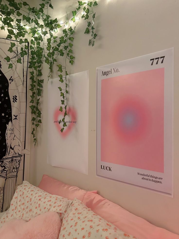 there is a bed with pink sheets and pillows next to a poster on the wall