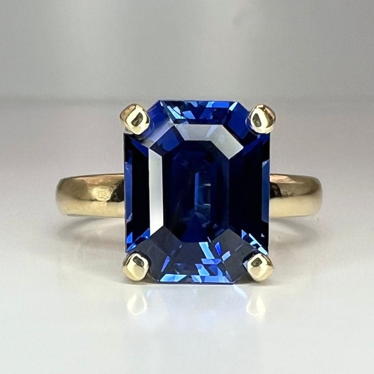 "This ring is a Emerald cut blue sapphire engagement ring set in 14k solid yellow gold. The  Blue sapphire solitaire ring is the September birthstone. This Blue sapphire ring can also make a great wedding, anniversary, promise ring or something blue for a bridal gift.  This ring is an emerald cut blue sapphire solitaire, 14k yellow gold #6132 This ring can be made with many different stone colors Message us for pricing on different color/type stones for more blue sapphire rings click here: https Sapphire Engagement Ring Yellow, Sapphire Engagement Ring Yellow Gold, Emerald Cut Sapphire Ring, Sapphire Engagement Ring Set, Engagement Ring Yellow Gold, Engagement Ring Yellow, Sapphire Solitaire Ring, Blue Sapphire Engagement Ring, Blue Sapphire Pendant