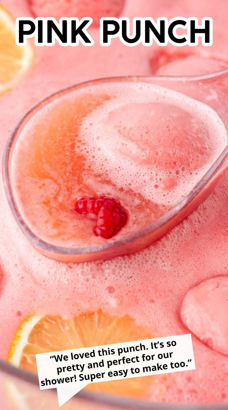 a pink punch in a glass with a spoon