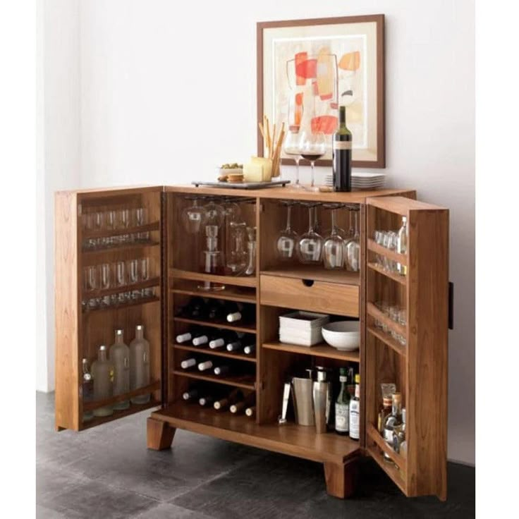 a wooden cabinet filled with lots of bottles and glasses