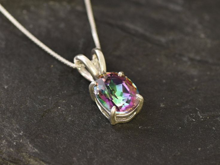 Mystic Topaz Pendant set with a Natural Mystic Topaz in a diamond cut & interchanging purple/green color, at 10x8mm, 3 Carats, from Brazil. Purple Solitaire Necklace made of  Solid 925 Sterling Silver ☞ made to last. Matching Ring: www.etsy.com/uk/listing/718725581 Matching Earrings: www.etsy.com/uk/listing/705259786 D E T A I L S ✓ Adina Stone GIFT BOX provided ♕ GUARANTEE on materials ♕ Hallmark on each piece ✓ Stone: Natural Mystic Topaz, 10x8mm, 3 Carats (Brazil) ✓ More Beautiful jewellery o Mystic Topaz Necklace, Rainbow Topaz, Topaz Pendant, Dainty Pendant, Topaz Necklace, Matching Ring, Real Jewelry, Solitaire Necklaces, Mystic Topaz