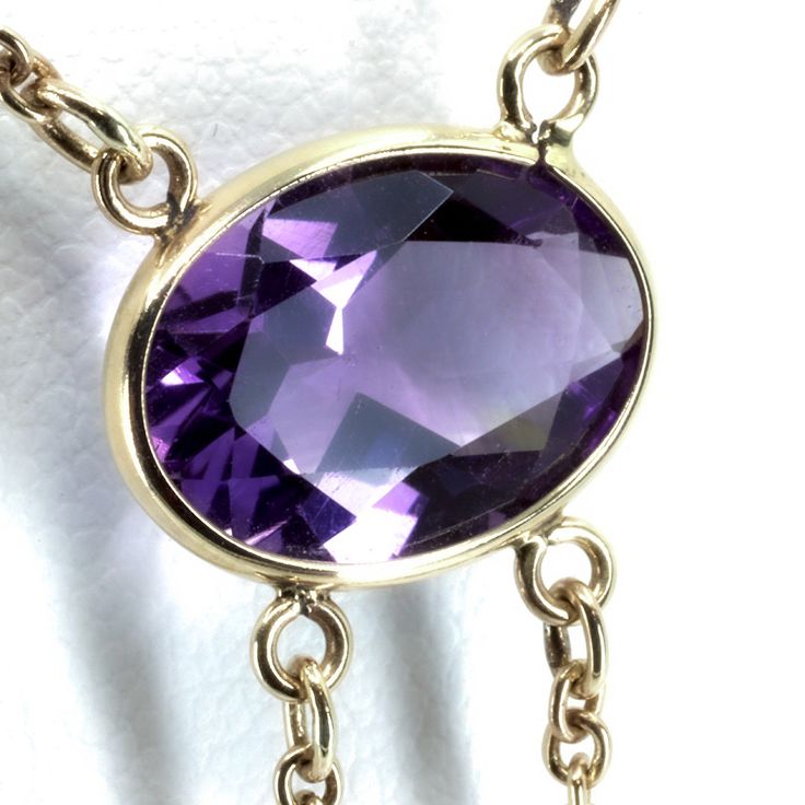 "Vintage Minimalist Lavalier Necklace in 14k Gold with Bezel Set, Oval Cut, Amethysts. This necklace bears a makers hallmark with \"rings and the letter A\", there is also a 14k Purity mark, no origin mark. Necklace measures 15.75\" Total Drop of Lavalier Pendant 1.75\" 1X - 13.6x9.8x5.85 mm Large Amethyst Oval Gem 2X - 7x4.5x3.75 mm Small Amethyst Oval Gems Total weight of necklace 0.179 Oz (78.1 g) This item is vintage. It has been cherished, worn, and preserved by possibly many over the decad Delicate Oval Pendant Necklace For Formal Occasions, Delicate Oval Necklace For Formal Occasions, Formal Briolette Necklace With Polished Finish, Dainty Briolette Necklace For Formal Occasions, Delicate Hallmarked Necklaces For Formal Occasions, Formal Briolette Necklace With Bezel Setting, Formal Yellow Gold Briolette Necklace, Formal Briolette Jewelry With Delicate Chain, Formal 14k Gold Necklace With Bezel Setting