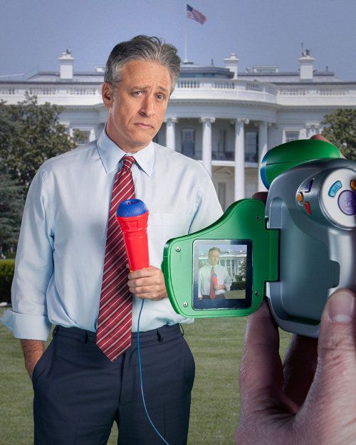 a man holding a camera in front of the white house with an eyeball on it