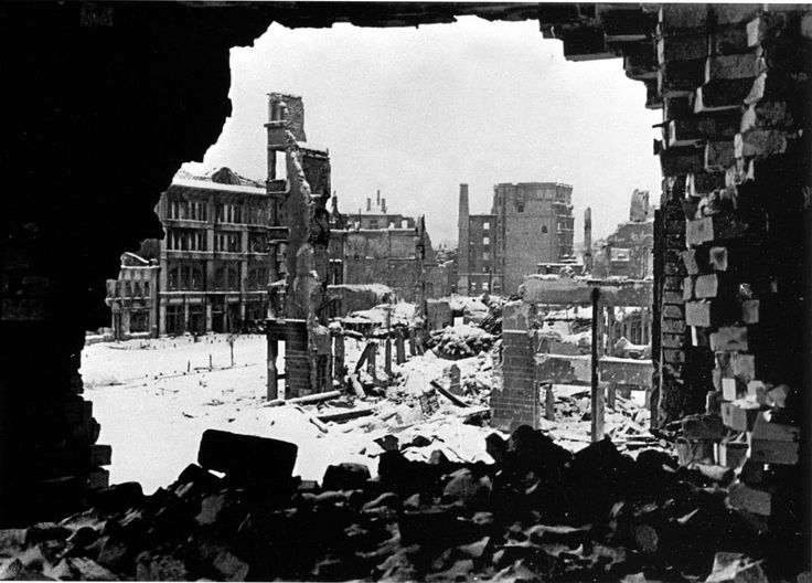 black and white photograph of destroyed buildings in an old city