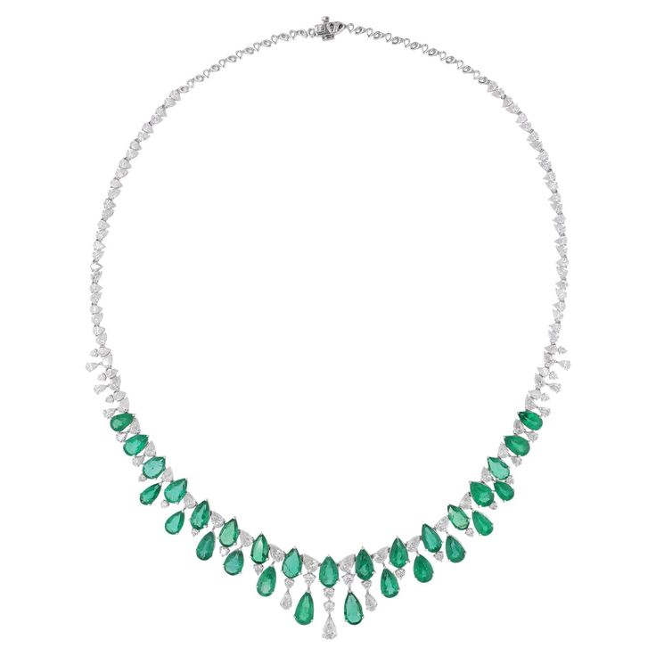 Immerse yourself in the enchanting allure of this Pear Zambian Emerald Gemstone Necklace, adorned with Pear and Round Diamonds, a breathtaking masterpiece of fine jewelry crafted in 18 Karat White Gold. Item Code :- SEN-51197 Gross Wt. :- 29.42 gm 18k White Gold Wt. :- 23.91 gm Natural Diamond Wt. :- 9.30 Ct. ( AVERAGE DIAMOND CLARITY SI1-SI2 & COLOR H-I ) Zambian Emerald Wt. :- 18.26 Ct. Necklace Length :- 16 Inches Long ✦ Sizing ..................... We can adjust most items to fit your sizing Luxury Exquisite Oval Emerald Necklace, Luxury Diamond White Emerald Necklace, Luxury White Gold Gemstone Necklace, Luxury Teardrop Emerald Necklace With 17 Jewels, Luxury Pear-shaped Emerald Gemstone Necklace, Luxury Teardrop Diamond Necklace With Gemstone, Luxury Diamond Teardrop Necklace, Briolette Emerald Necklace For Formal Occasions, Drop Emerald Necklaces For Formal Occasions