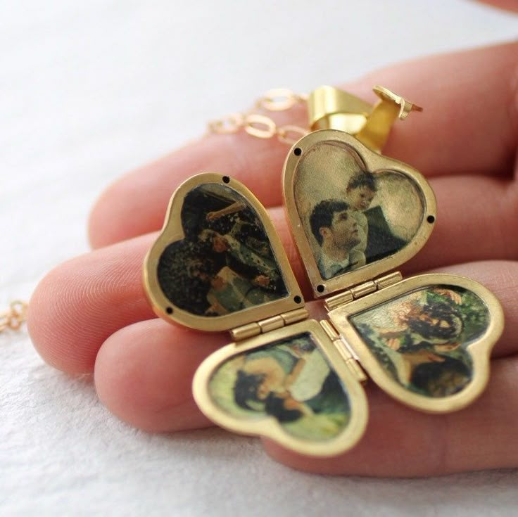 This beautifully designed personalized photo locket features a heart shape which opens out to reveal space for four different photographs, instead of the usual two! We can professionally etch your photographs inside the locket for you, to make a special and unique personalized gift. The locket is solid brass and the fine chain and clasps are gold plated brass. When clasped together, the pendant is a great, versatile size, which would look equally good worn short or long. Please refer to our illu Miss You Gifts, Engraved Locket, Silk Purse, Photo Locket Necklace, Heart Locket Necklace, Vintage Lockets, Photo Necklace, Memorial Necklace, Clover Necklace