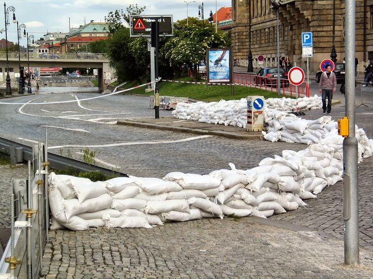 bags of sand sitting on the side of a road