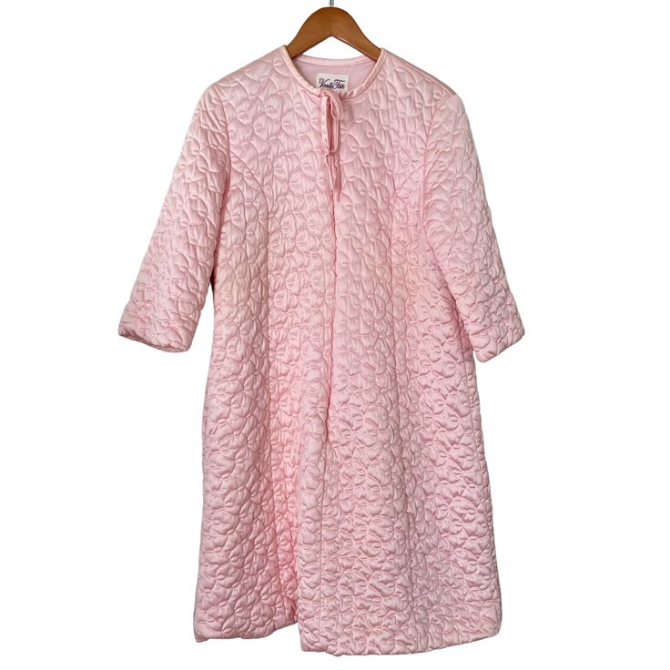 This vintage pink robe from Vanity Fair provides a stylish and comfortable option for your loungewear collection. The robe features a classic design with a soft, flowy material that drapes elegantly over your body. The brand's attention to detail is evident in the delicate lace trim around the cuffs and neckline, adding a feminine touch to the overall look. Perfect for lazy weekends or cozy evenings at home, this robe is a great addition to any wardrobe. It's a beautiful piece of vintage clothin Long Sleeve Pink Nightgown For Spring, Spring Long Robe For Home, Long Spring Robe For Home, Vintage Pink Long Sleeve Sleepwear, Vintage Pink Sleepwear For Spring, Spring Overnight Robe With Long Sleeves, Pink Feminine Robe For Sleepover, Feminine Pink Robe For Sleepover, Spring Overnight Long Sleeve Robe