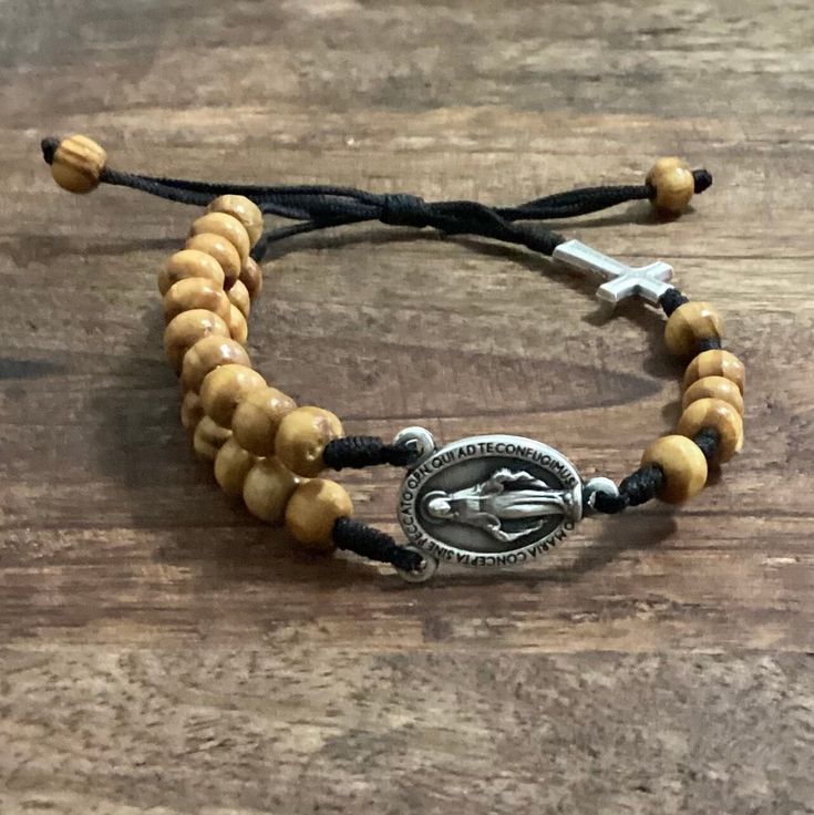 Lightweight and comfortable to wear. Perfect bracelet for everyday! A nice gift for a loved one or a statement of faith to wear yourself. For more similar items and different colors visit our store: https://www.etsy.com/shop/Thelightjewelry?ref=seller-platform-mcnav Adjustable Wooden Beads Rosary Bracelet For Meditation, Adjustable Brown Rosary Bracelet For Meditation, Spiritual Brown Rosary Bracelet With Wooden Beads, Spiritual Adjustable Natural Wood Beaded Bracelets, Adjustable Wooden Beads Rosary Bracelet Gift, Adjustable Wooden Bead Rosary Bracelet Gift, Adjustable Natural Wood Beaded Bracelets, Adjustable Brown Wooden Beads Rosary Bracelet, Adjustable Brown Hand-strung Rosary