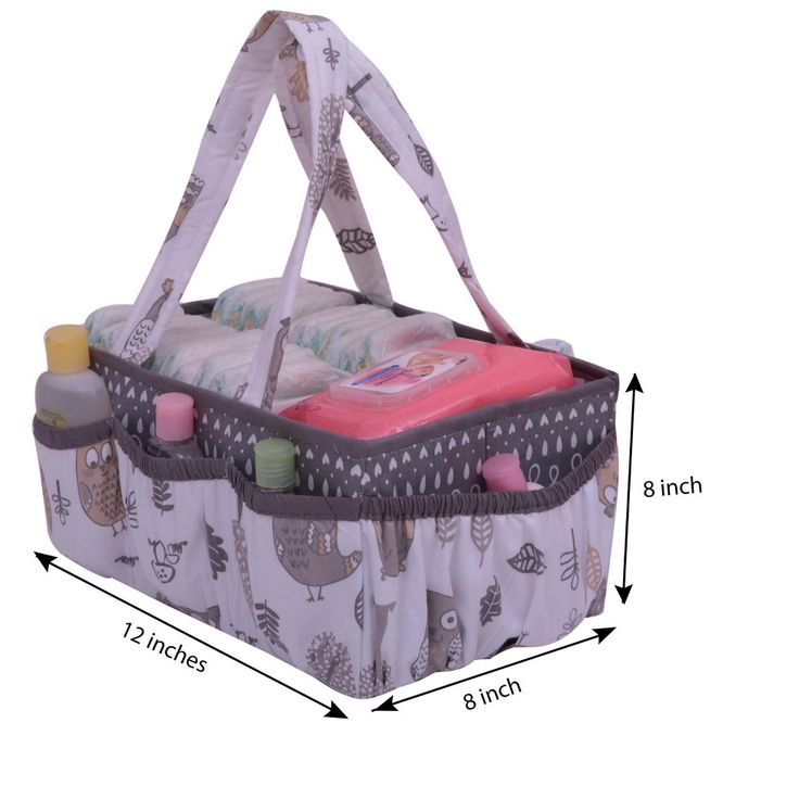 the large bag is filled with baby items and has an attached strap to handle it