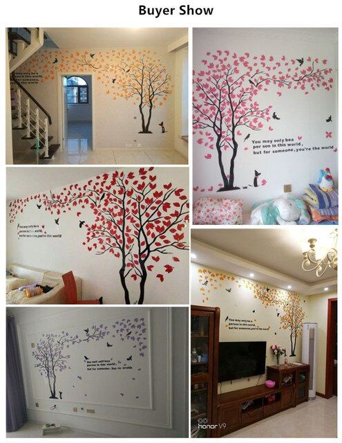 the wall decals in this living room are beautiful