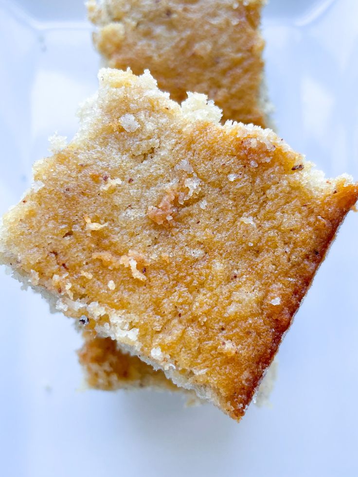 two pieces of cake sitting on top of a white plate