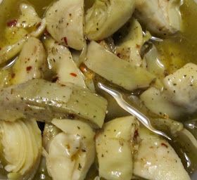 chicken and artichoke soup in a white bowl