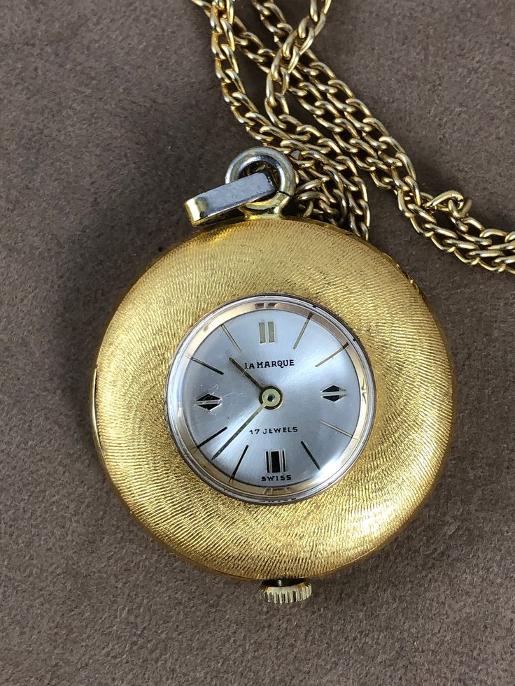 Nurse's Gift Swiss Made La Marque 17 Jewels Vintage Mechanical Wind Up Necklace Pendant Watch Vintage La Marque 17 Jewel Swiss Made Pendant Watch Swirling Brocading on both sides comes with 24 inch Vermeil Rope Necklace shipping included Pocket Watch Necklace, Pendant Watch, Heavy Chain, Pendant Watches, Watch Vintage, Rope Necklace, Gold Hands, Watch Necklace, Swiss Made