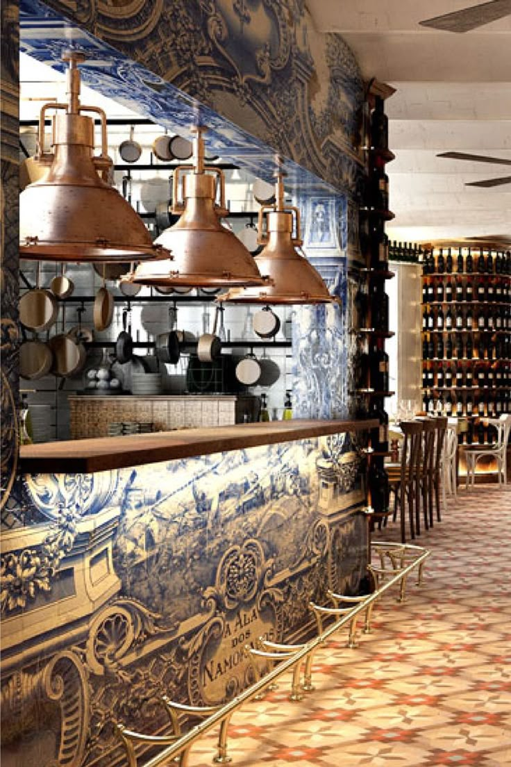 the interior of a restaurant with blue and gold tiles