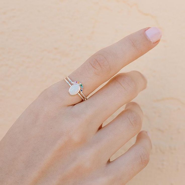 Our Rainbow Arch ring will add the perfect splash of color to your ring stack and looks equally cool worn solo. A beautiful symbol to celebrate love, hope and inclusion. Available in gold or silver. DETAILS 14kt gold plated or sterling silver sizes 5-12 available 1.5mm band Looks beautiful stacked with our opal solitaire ring