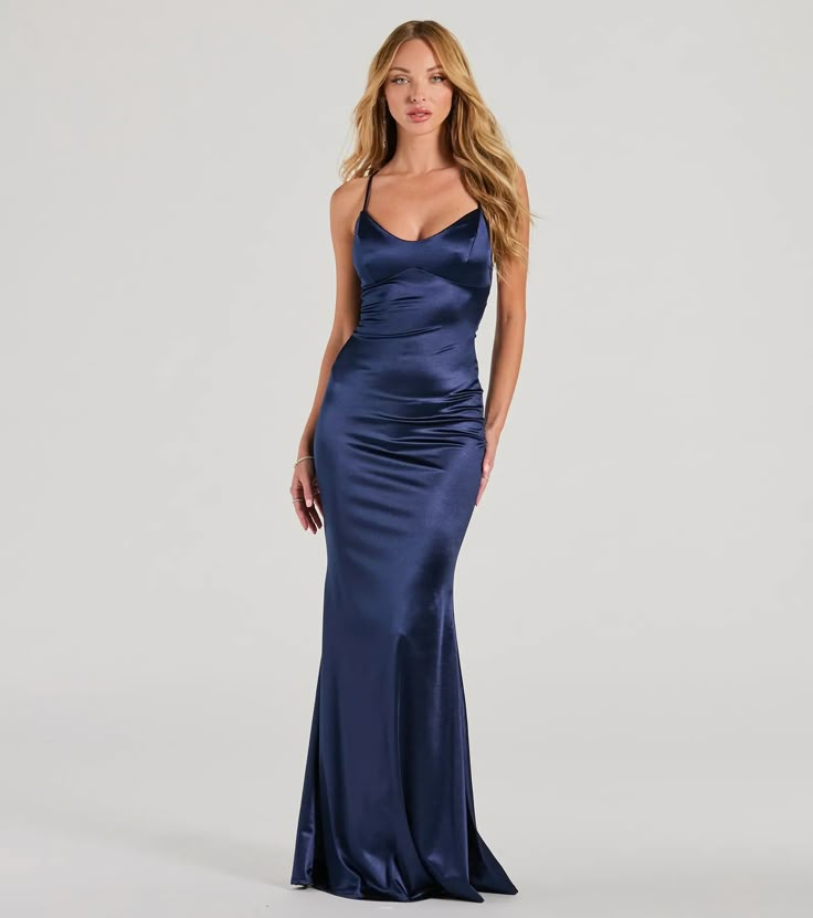 You're sure to sweep everyone off their feet in the Emmie satin formal dress for a simply dreamy look at banquets or weddings!  Made from high-quality satin-knit fabric, this dress exudes elegance and will make you stand out at any formal event. She boasts a flattering V-neckline and spaghetti straps, creating a feminine and elegant look. The lace-up back adds a touch of sophistication, while the mermaid silhouette and floor-length hem provide a glamorous finish. Complete the look with a grand n Windsor Navy Blue Dress, Satin Navy Prom Dress, Blue Full Length Dress, Navy Blue Prom Dresses Long Corset, Navy Spaghetti Strap Dress, Navy Blue Cocktail Dress Classy, Dark Blue Prom Dress Simple, Satin Floor Length Dress, Deep Blue Silk Dress