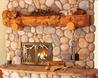 a stone fireplace with logs and decorations on it