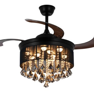 a black ceiling fan with chandelier hanging from it's blades and light bulbs