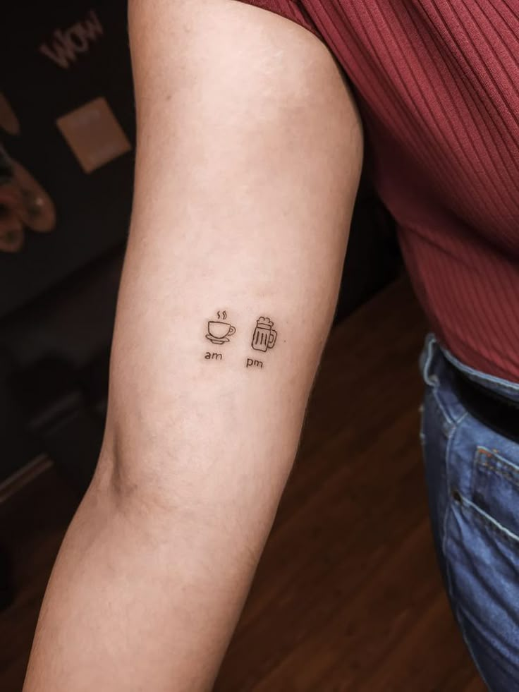 a woman with a tattoo on her arm that says coffee and tea in small letters