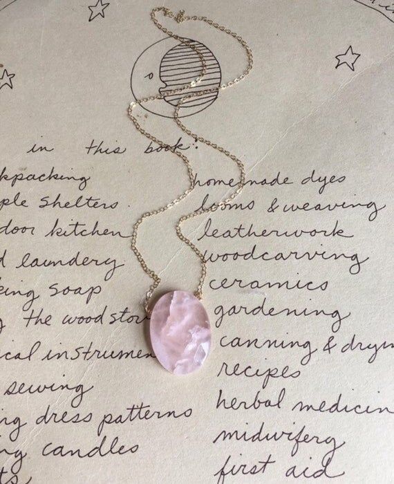 Pretty in pink. This rose quartz crystal pendant necklace is the perfect healing piece to add to your jewelry collection. Exuding dusty soft shades of pink, rose quartz helps soothe your heart and emit love to those all around you. Embrace the delightful beauty and tranquil benefits of this gentle and graceful creation.   Pink Rose Quartz Crystal Pendant Necklace•Beautifully polished double terminated 25-30mm gorgeous piece •Soft and feminine style•Loving calm energy — speaks directly to your he Rose Quartz Benefits, Crystal Necklace Rose, Rose Quartz Pendant Necklace, Pink Stone Necklace, Calm Energy, Rose Quartz Necklace Pendants, Pink Pouch, Quartz Pendant Necklace, Soft And Feminine