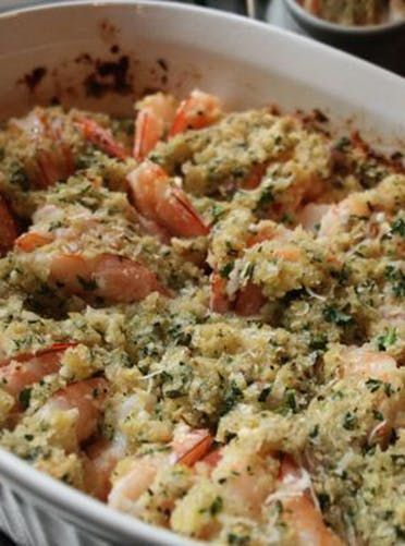 a casserole dish with shrimp and herbs in it