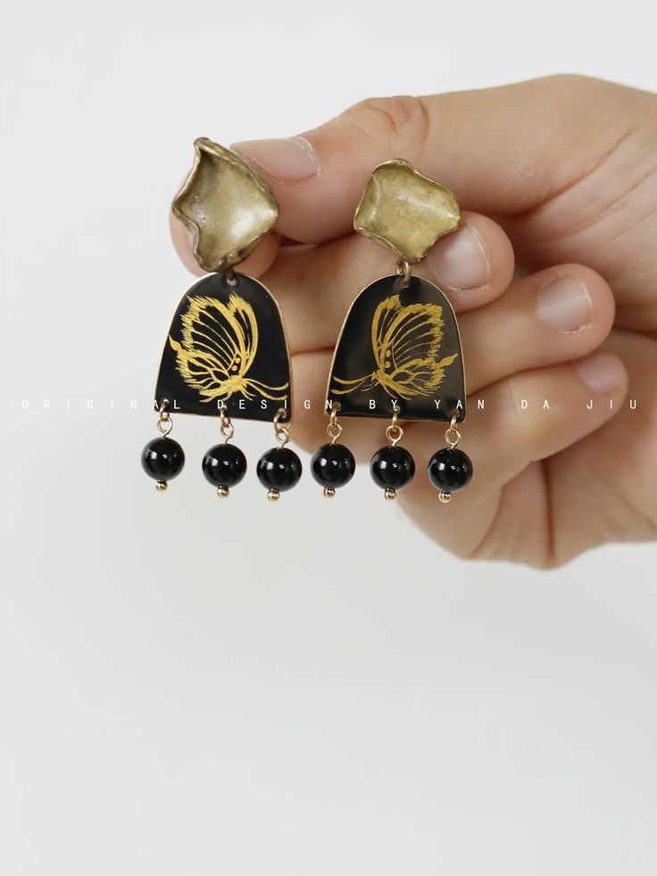 Chinese Lacquer Butterfly Earrings | Jewelry | Three Fleas Artistic Black Dangle Jewelry, Black Jewelry With Artistic Design, Black Artistic Jewelry, Black Jewelry With Artistic Design As Gift, Artistic Black Drop Earrings, Black Earrings With Artistic Design For Gift, Black Earrings With Artistic Design As A Gift, Artistic Black Jewelry With Matching Earrings, Artisan Black Earrings Gift