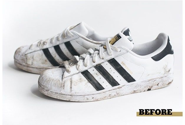 an old pair of white and black adidas sneakers on a white background with the words view the photos